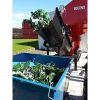 A SK370 compacting beer canisters